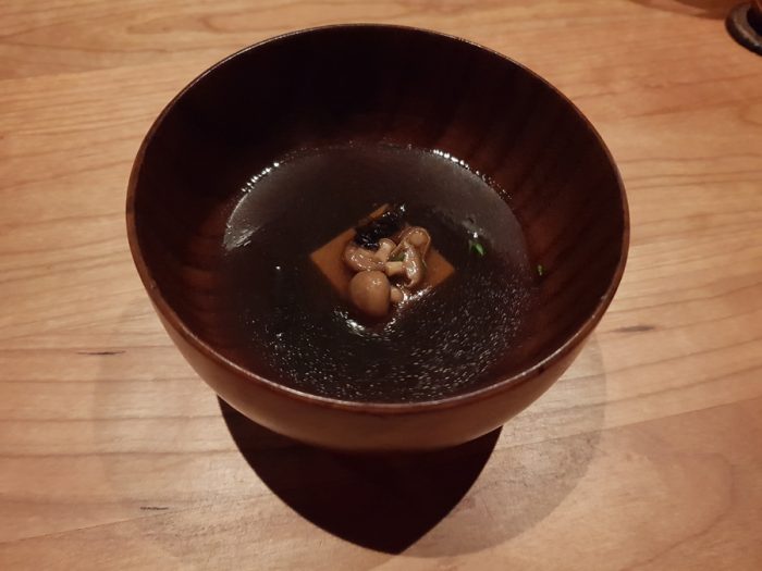 tea of fermented mushrooms and grilled quail with red seaweed and silken tofu