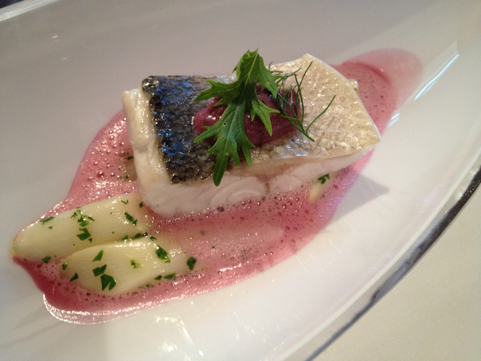 Sea bass with asparagus from Eferding, caper-cabbage-paste and elder-red cabbage-sauce