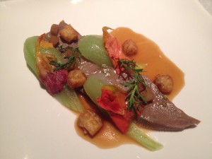 Braised veal's tongue with rhubarb, salted plums and nasturtium